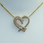 Flott hjerteanheng i gult gull 14 k med 65 diamanter