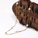 Halskjede i gult gull 14 k med perler