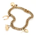 Armbånd i gult gull 14 k med charms