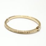 Mønstret armring i gult gull 18 k