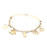 Armbånd i gult gull 14 k med charms